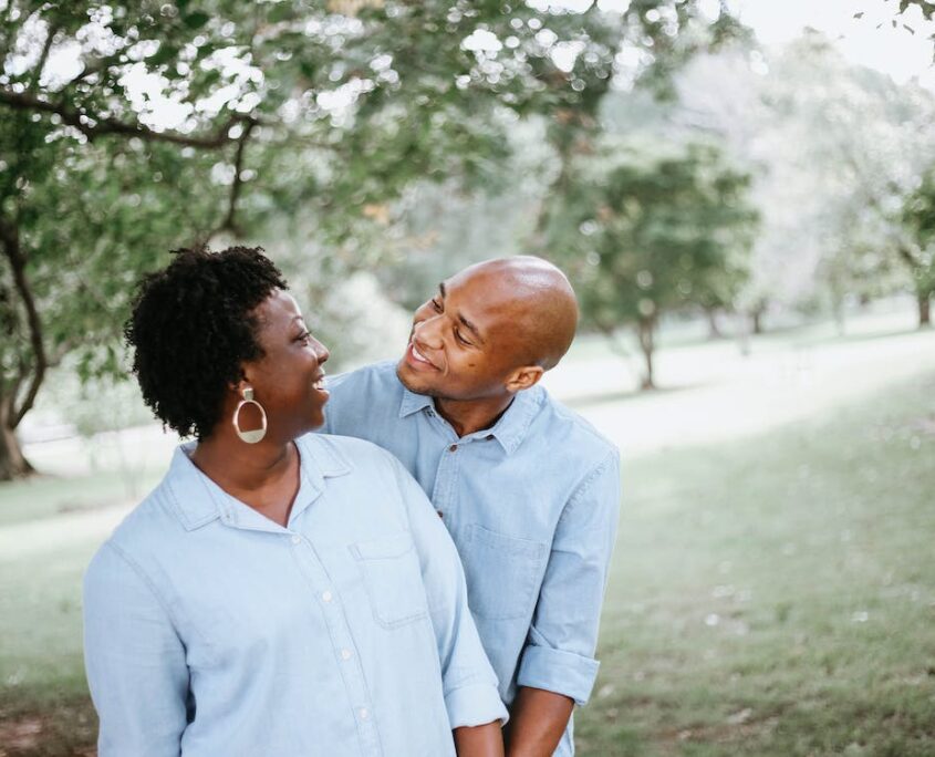 A couple looking at each other and smiling