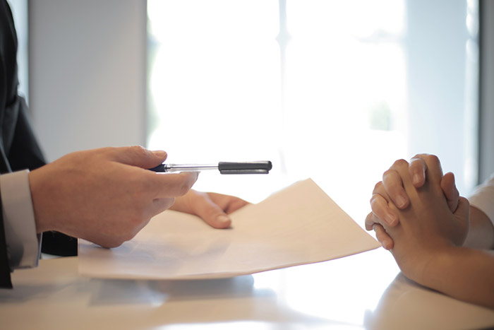 An estate planning attorney discussing wills and trusts with a client